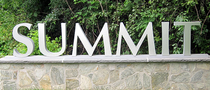 Sign showing the word Summit